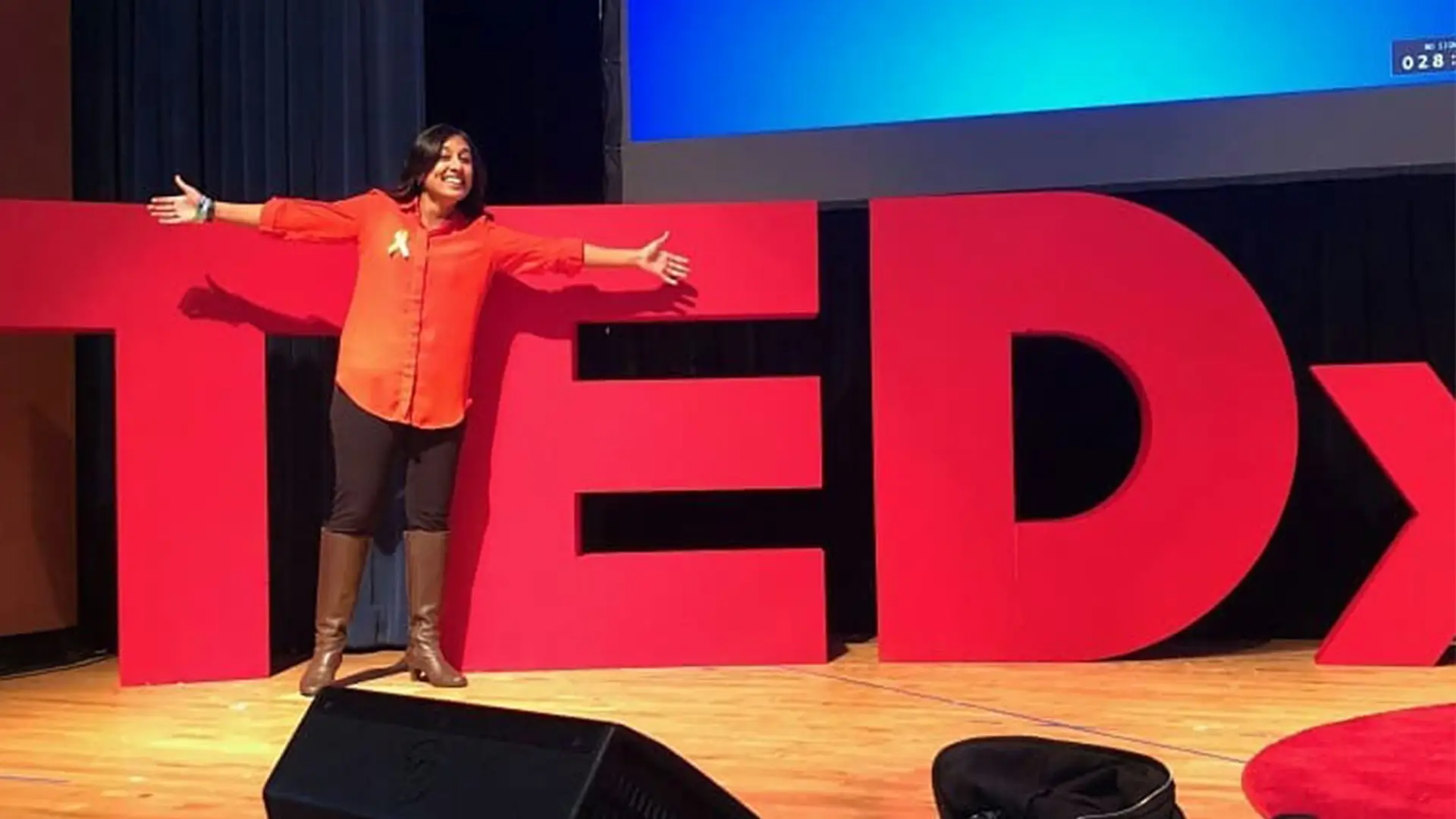 Hufsa Ahmad, LCSW delivering her keynote and TEDx talk!